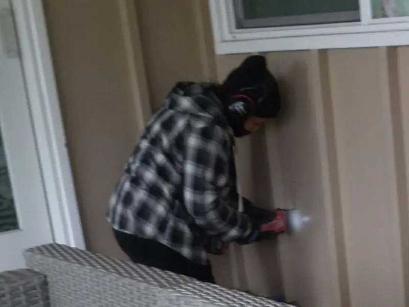 Professional electrician installing an exterior outlet in Georgetown