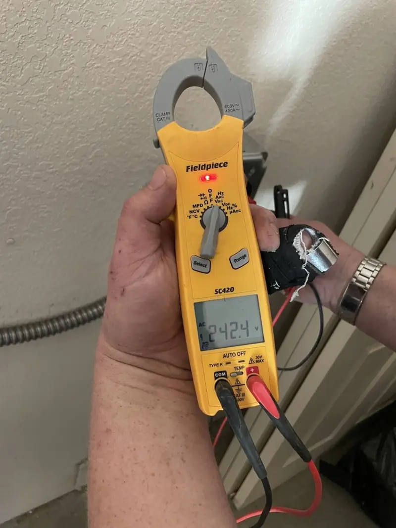 Voltage testing with clamp meter during Recessed Lighting Installation in Georgetown